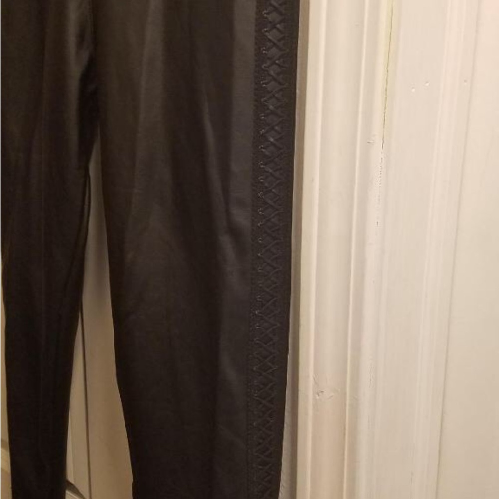 Black faux leather leggings with side design